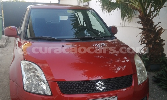 Buy Used Suzuki Swift Red Car in Willemstad in Curacao
